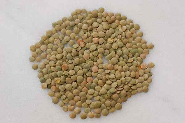 Unsorted lentils Unsorted lentils spread over a cutting board