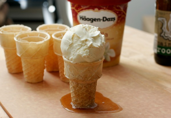 Finished Root Beer Hover, ready to eat A scoop of vanilla ice cream on an ice cream cone filled with root beer; root beer is leaking out the bottom of the cone and has formed a puddle